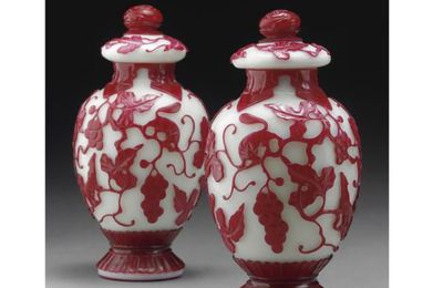 A pair of red-overlay white glass jars and covers. Qing Dynasty, 19th century