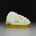 A celadon jade carving of a mountain with figures, 19th century