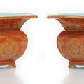 A fine pair of coral-ground gilt painted porcelain planters, China, Jiaqing-Daoguang period. 