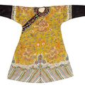 A yellow silk ground embroidered dragon robe. 19th century