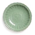 A carved and molded 'Longquan' celadon-glazed dish, Song dynasty (960-1279)