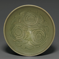 A carved Yaozhou 'Chrysanthemum' bowl, Northern Song-Jin dynasty, 12th-13th century