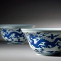 A pair of blue and white ogee-shaped 'dragon' bowls, Qianlong seal marks and of the period (1736-1795)
