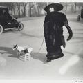 ​  ​​  ​Jacques-Henri Lartigue (French, 1894-1986), Lady with Fur Muff and Dogs, Avenue des Acacias, Paris, 1911