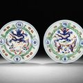 A fine and rare pair of wucai 'dragon and phoenix' dishes, Wanli six-character marks and of the period