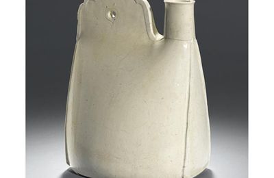 An unusual white stoneware flask in the form of a leather pouch. Liao Dynasty, 10th Century. 