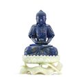 A finely carved and rare lapis lazuli figure of Amitabha Buddha on a white jade lotus stand, Qing dynasty, Qianlong period