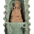 An unusual celadon-glazed and biscuit shrine of Guanyin, early Ming dynasty