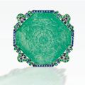 A very rare platinum, carved emerald, emerald and sapphire brooch, Cartier, New York, circa 1920