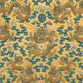 A yellow-ground silk embroidered 'Nine dragons' kang cushion cover, circa 1800