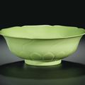 A fine and very rare lime-green glazed molded 'mallow-flower' bowl, Yongzheng mark and period (1723-1735)