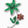 A jadeite and diamond floral brooch 