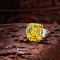 An important fancy coloured diamond and diamond ring