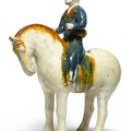 A rare sancai-glazed anf blue-glazed pottery figure of an equestrian, Tang dynasty (618-907)