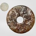 A carved jade bi disc with nine chilong and a carved dragon pendant, Ming-early Qing dynasty