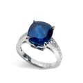 Boucheron. Bague en or gris sertie d'un saphir de 8.03 ct taillé en coussin épaulé d'une chute de diamants taillés en brillant