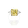 Platinum, 18 karat gold, fancy intense yellow diamond and diamond ring