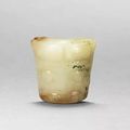 A rare jade ox-head pendant, Late Shang Dynasty