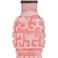 A rare sandwiched pink glass 'chilong' snuff bottle, Qing dynasty, 18th-19th century