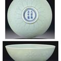 An unusual celadon-glazed carved bowl, Yongzheng six-character mark in underglaze blue within a double circle and of the period 