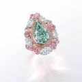 A 5.11 carats pear-shaped fancy green diamond and diamond ring