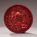 A very rare cinnabar lacquer 'lion' dish, Yuan dynasty, 14th century