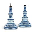 A rare pair of large Ming-style blue and white candlesticks, 18th century
