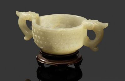 A pale green jade double-handed cup, Ming Dynasty (1368-1644)
