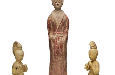 A pair of straw-glazed figures of female musicians, Tang dynasty (618-907)