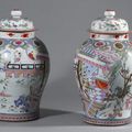 A superb pair of chinese porcelain `famille-rose` baluster jars and covers, Qing dynasty, Yongzheng period (1723-35).