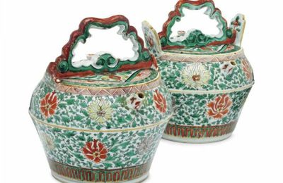 A pair of Chinese famille verte watering pots and covers, second half 17th century
