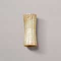  An archaistic carved jade bead