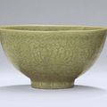 A very fine and rare Longquan celadon carved deep bowl, Ming dynasty, early 15th century