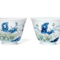 A pair of famille verte 'month' cups, Qianlong six-character seal marks in underglaze blue and of the period (1736-1795)