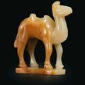 A very rare pale beigish-white and yellowish-brown jade miniature figure of a standing Bactrian camel, Tang-Yuan dynasty