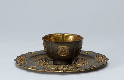 A parcel gilt bronze cup and stand, Ming dynasty, 16th-17th century