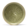 A small molded 'Yaozhou' celadon-glazed conical bowl, Northern Song dynasty (960-1127)