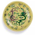 A rare biscuit-enamelled sancai 'Dragon' dish, Mark and period of Kangxi (1662-1722)