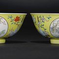 A fine pair of famille-rose enamelled yellow sgraffiato ground 'Ram' medallion bowls, Daoguang seal marks and period