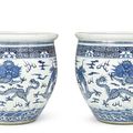 A large pair of blue and white 'Dragon' jardinières, Qing dynasty, 19th century