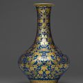 An imperial blue-ground gilt-decorated 'Butterfly and gourd' vase, Jiaqing six-character seal mark in iron red and of the period