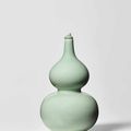 A celadon-glazed double-gourd vase, Qianlong seal mark and of the period (1736-1795)
