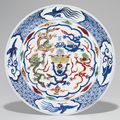 A rare wucai 'Dragon' dish, Wanli six-character mark in underglaze blue within a double circle and of the period (1573-1619)