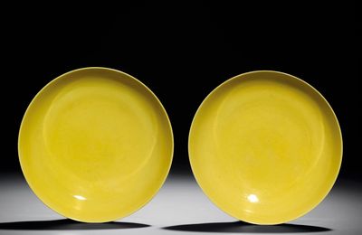 A fine pair of yellow-enamelled saucers, Yongzheng six-character marks within double circles and of the period (1723-1735)