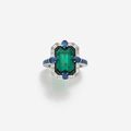 An 6.22 cts Zambian emerald, diamond, sapphire and 18k white gold ring, by John Rubel Paris