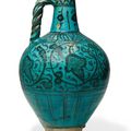 A rare turquoise-glazed pottery jug, Damascus, Syria, 14th century