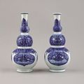 A pair of Chinese porcelain blue and white triple-gourd bottle vases, Kangxi, 1662-1722