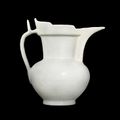 A rare incised white-glazed 'monk's cap' ewer, Ming dynasty, Yongle period 