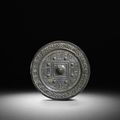 An archaic bronze 'TLV' mirror, Han dynasty