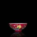 A rare and brilliantly enamelled ruby-ground 'yangcai' 'floral' bowl. Yongzheng yuzhi four-character mark and of the period